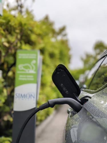 a bike parked next to a sign on a road at Simon Hotel in Pomezia