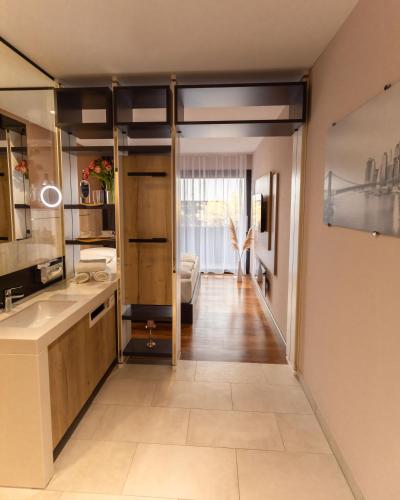 a kitchen with a door leading to a living room at 24Seven Hotel Schwabach in Schwabach
