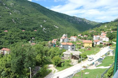 a small town on a mountain with a road at Lavender Bay Apartments D3 or D5 I by Andreas Crivellaro in Donji Morinj