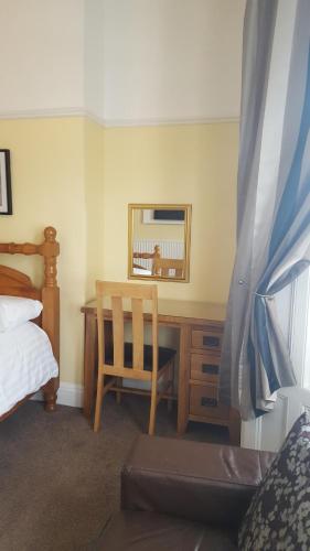 Ένα ή περισσότερα κρεβάτια σε δωμάτιο στο The Beacon Hotel