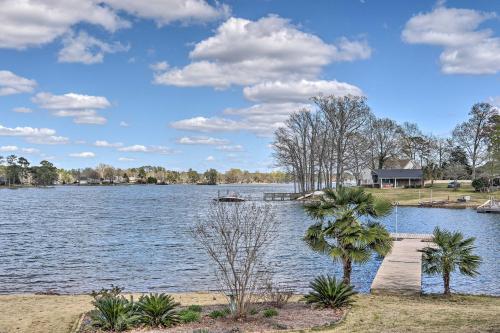 a view of a lake with trees and a house at Quiet Lakefront Retreat with Boat Ramp and 2 Docks in Hollywood Point