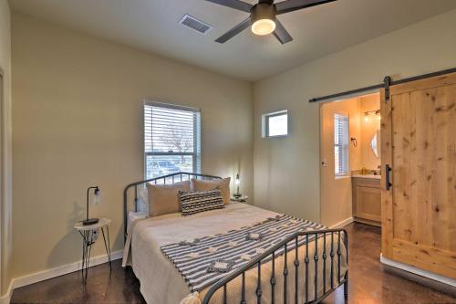 a bedroom with a bed and a ceiling fan at Modern Boho Retreat 3 Blocks to Dtwn and Rte 66 in Williams