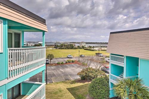 a view from the balcony of a building with a parking lot at Beachfront Condo with Boardwalk and Pool Access! in Atlantic Beach