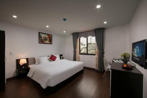 Postel nebo postele na pokoji v ubytování Hanoi Aria Central Hotel & Spa