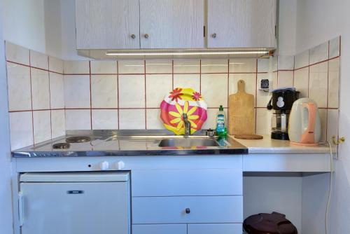 a kitchen with a sink and a counter top at Galissas Studios in Galissas