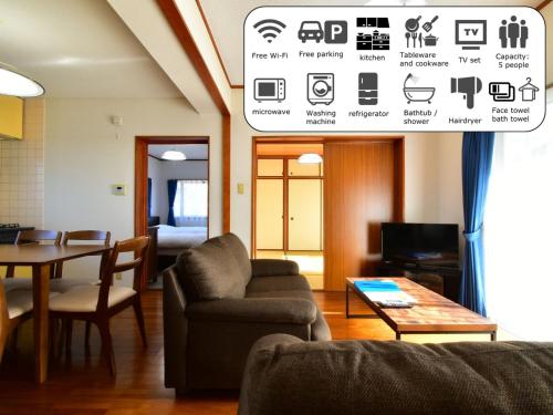 a living room with a couch and a table at Maison Ota Building A Building B - Vacation STAY 11138 in Takamatsu
