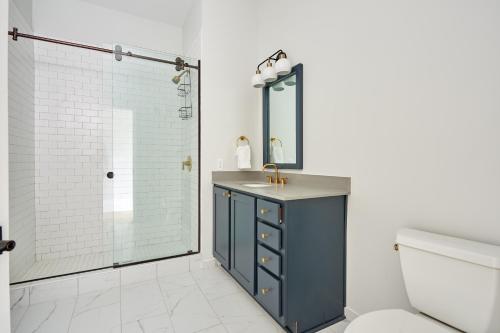 a bathroom with a blue sink and a shower at Sonder at The Vitascope in New Orleans