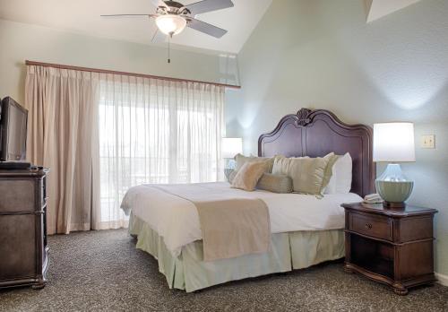 a bedroom with a large bed and a window at WorldMark Branson in Branson