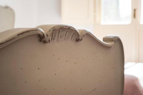 a close up of the back of a chair at Fattoria Pian Di Rocca in Castiglione della Pescaia