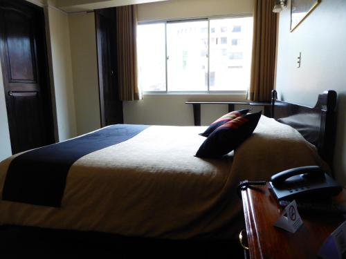 Postel nebo postele na pokoji v ubytování Hotel Sagarnaga
