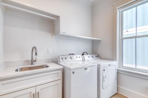 a white kitchen with a sink and a dishwasher at Beach Vista Two in Orange Beach
