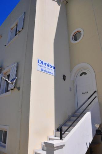 a white building with a staircase leading to a door at Dimitra Apartments Zakros Village in Káto Zákros