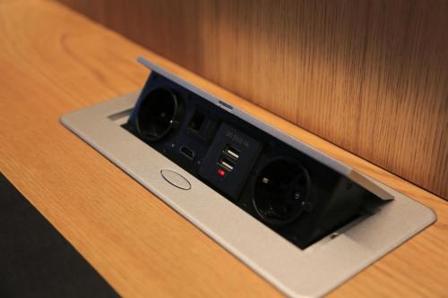 a remote control sitting on top of a cabinet at Les Pantoufles dans le Pré in Eppeldorf