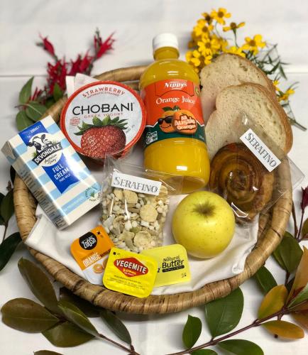 a basket filled with different types of food on a table at Serafino McLaren Vale in McLaren Vale