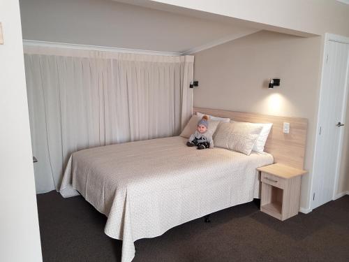 Postel nebo postele na pokoji v ubytování Carramar Motor Inn