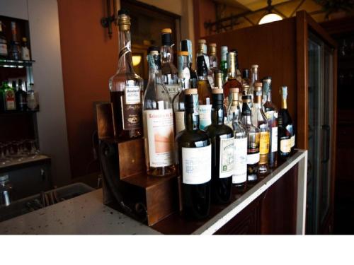 a group of bottles of wine sitting on a counter at Hotel Gran Duca in Livorno
