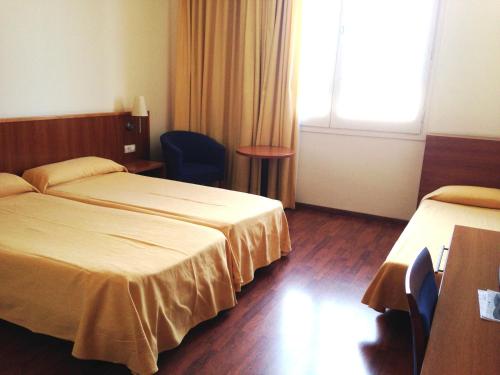 Ένα ή περισσότερα κρεβάτια σε δωμάτιο στο Hotel Berga Park