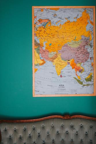 a map of the world hanging on a wall at Habari We Dorm in Bari