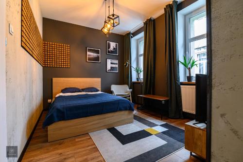 Postel nebo postele na pokoji v ubytování Apartamenty Wyszyńskiego 2