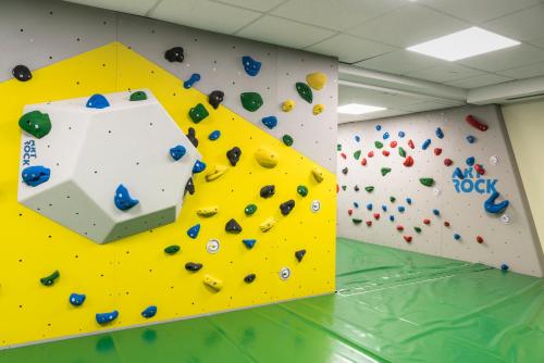 a climbing wall in a climbing gym with a rock wall at Falkensteiner Family Hotel Sonnenalpe in Sonnenalpe Nassfeld