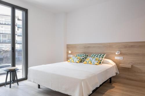 Postel nebo postele na pokoji v ubytování Apartaments La Rosella