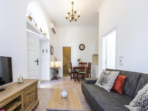 a living room with a couch and a tv at Apartments Franka Old Town in Dubrovnik