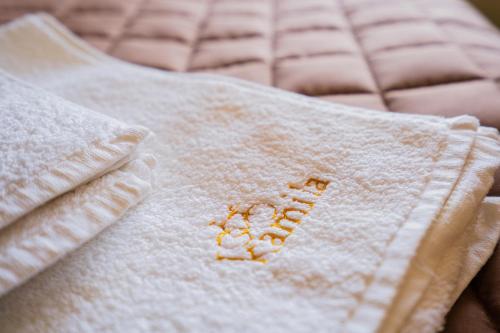 a close up of a white blanket on a bed at Готель-ресторан Каміла in Polyana