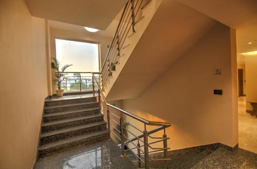 a staircase in a house with a window at Hotel 91 Huda City Centre in Gurgaon