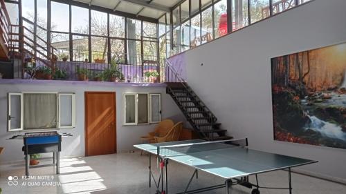 a room with a glass table and a staircase at Albergo B&B Antica Trattoria Bacco in Circello