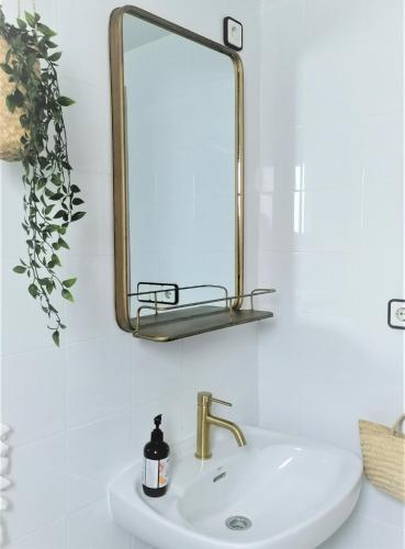 a bathroom with a sink and a mirror at Maison Dya Altea in Altea