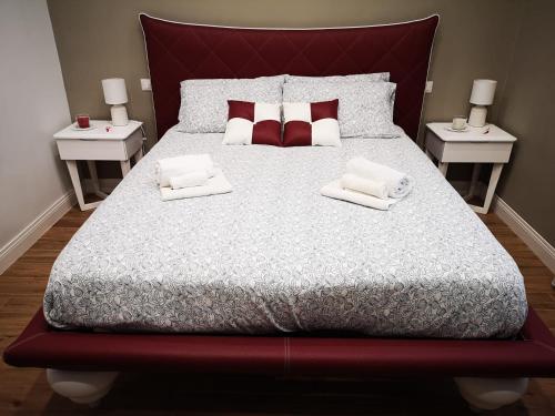 a bedroom with a large bed with two night stands at Belvedere 75 in Naples