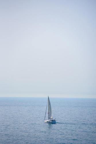 a sailboat in the middle of the ocean at Dream Penthouse in Haifa