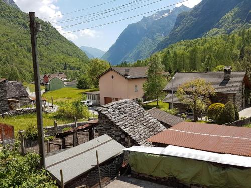 a small village with mountains in the background at Holiday Home Maria by Interhome in Brione