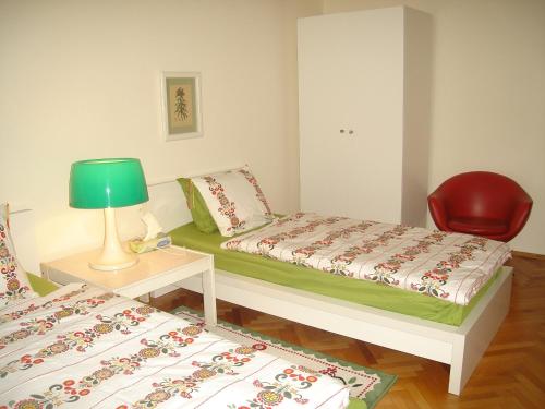 Ένα ή περισσότερα κρεβάτια σε δωμάτιο στο Bulhotel Pritzker Apartment