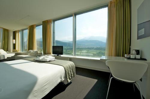 Posteľ alebo postele v izbe v ubytovaní Mercure Nerocubo Rovereto