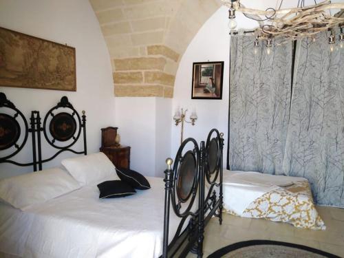 Cama o camas de una habitación en Masseria li Vecchi
