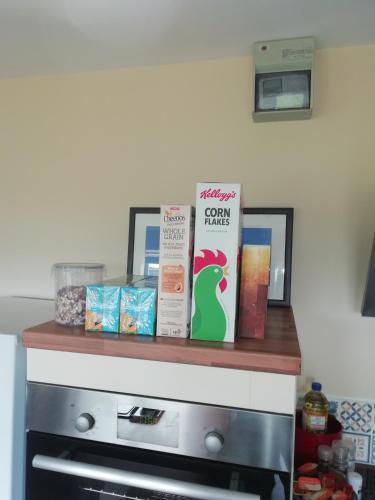a counter with books on top of a stove at The Studio in Georgeham