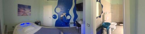 a hospital room with a bed and a bathroom at BnB Notte Stellata in Savigliano