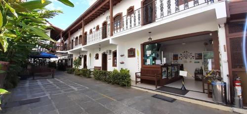 a store front of a building with a window at Pousada Doce Paraty in Paraty