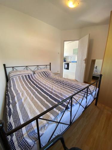 a bedroom with a bed in a room at Beachfront Apartment in Vir