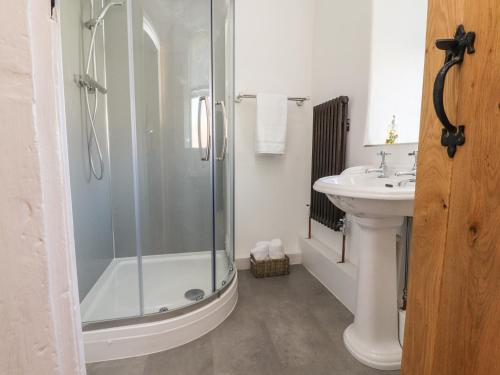 a bathroom with a shower and a sink at Sunny Bank in Lancaster