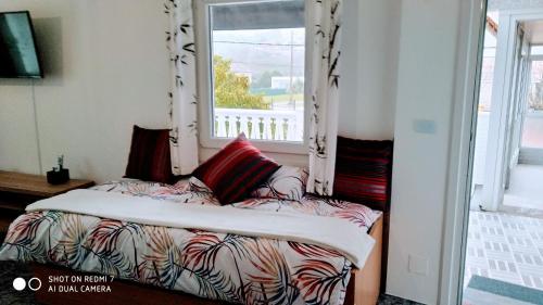 A bed or beds in a room at Perla