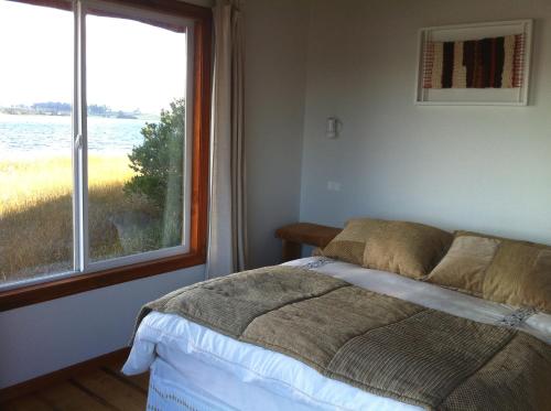 Postel nebo postele na pokoji v ubytování CABAÑAS Gracias a la Vida Lodge