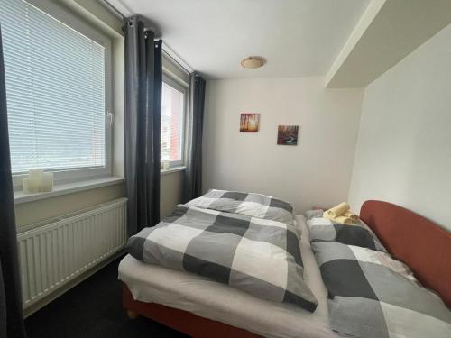 Postel nebo postele na pokoji v ubytování 3 IZBOVÝ krásny Apartmán DAVID A7 v Tatranskej Štrbe