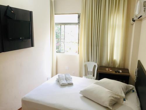 Un ou plusieurs lits dans un hébergement de l'établissement Hotel GMatos Belo Horizonte - By UP Hotel