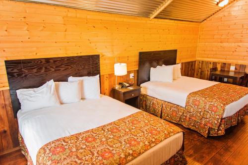 Postel nebo postele na pokoji v ubytování Lone Star Lodge