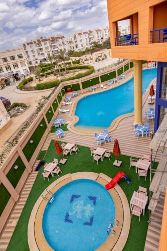 a view of a swimming pool at a resort at Royal Day Plaza Hotel in 6th Of October