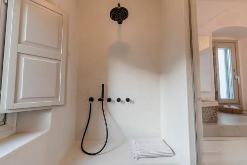 a bathroom with a shower and a sink at Bohemian Blue Villa - 7 BDRM - beach in 200m - MG Villas in Panormos Mykonos