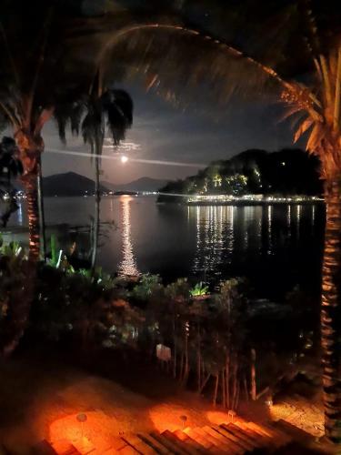 a view of a body of water at night at Cabana do Mar in Angra dos Reis