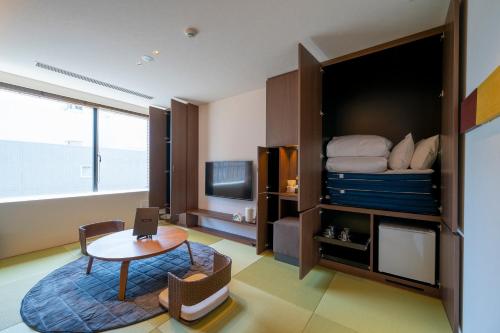 Postel nebo postele na pokoji v ubytování Torifito Hotel & Pod Kanazawa